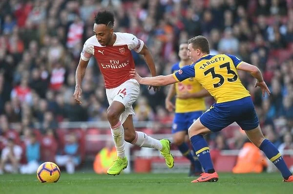 Arsenal's Aubameyang Faces Off Against Southampton's Targett in Premier League Clash