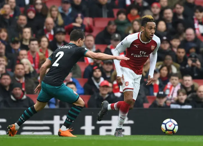 Framed Print : Arsenal's Aubameyang Faces Off Against Southampton's Cedric in Premier League Clash Framed Print : Arsenal's Aubameyang Faces Off Against Southampton's Cedric in Premier League Clash