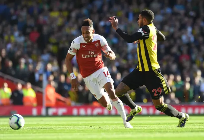 Framed Print : Arsenal's Aubameyang Faces Off Against Watford's Capoue in Premier League Clash