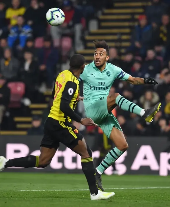Framed Print : Arsenal's Aubameyang Faces Off Against Watford's Kabasele in Premier League Clash