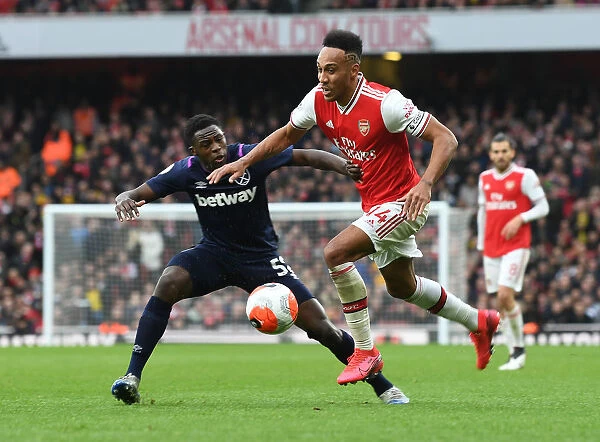 Arsenal's Aubameyang Faces Off Against West Ham's Nhakia in Premier League Clash