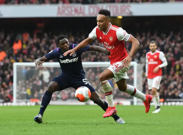 Framed Print : Arsenal's Aubameyang Faces Off Against West Ham's Nhakia in Premier League Clash Framed Print : Arsenal's Aubameyang Faces Off Against West Ham's Nhakia in Premier League Clash