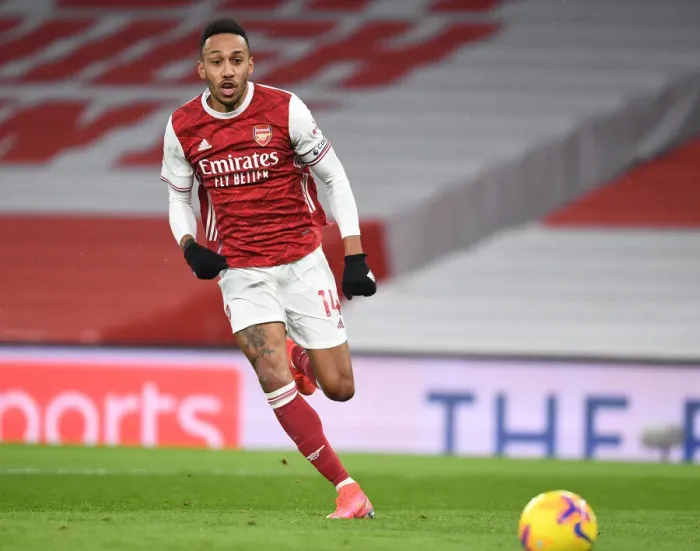 Framed Print : Arsenal's Aubameyang Goes Head-to-Head with Leeds United in Premier League Battle