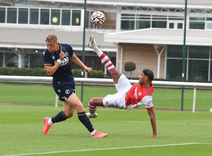Framed Print : Arsenal's Aubameyang Goes Head-to-Head with Millwall's Ballard in Pre-Season Clash