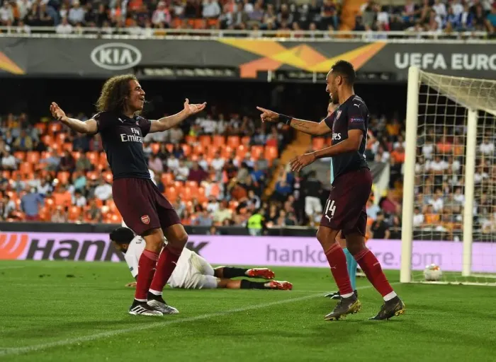 Framed Print : Arsenal's Aubameyang and Guendouzi Celebrate Goals in Europa League Semi-Final vs Valencia