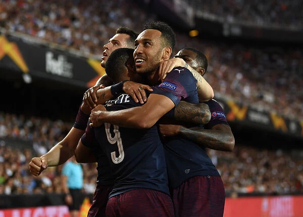 Arsenal's Aubameyang, Lacazette, and Xhaka Celebrate Goal in Europa League Semi-Final vs Valencia