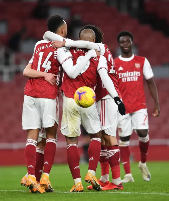 Framed Print : Arsenal's Aubameyang and Lacazette Celebrate Goals Amidst Empty Emirates Stadium Against Newcastle United (2021)