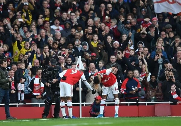 Arsenal's Aubameyang and Lacazette: Celebrating a Goal-Scoring Milestone Against Chelsea in the Premier League