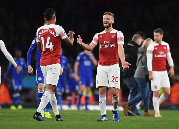 Arsenal's Aubameyang and Mustafi Celebrate Goal Against Leicester City