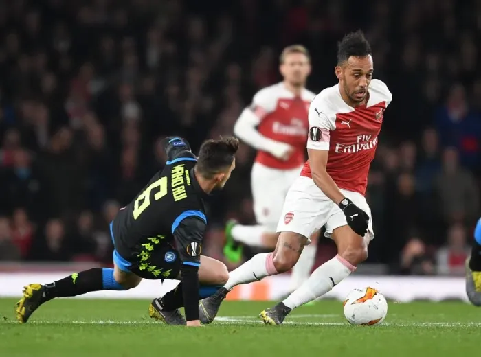 Framed Print : Arsenal's Aubameyang Outmaneuvers Napoli's Rui in Europa League Quarterfinal Clash Framed Print : Arsenal's Aubameyang Outmaneuvers Napoli's Rui in Europa League Quarterfinal Clash