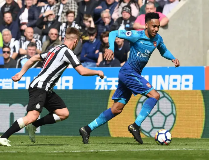 Framed Print : Arsenal's Aubameyang Outmaneuvers Newcastle's Ritchie in Premier League Clash Framed Print : Arsenal's Aubameyang Outmaneuvers Newcastle's Ritchie in Premier League Clash