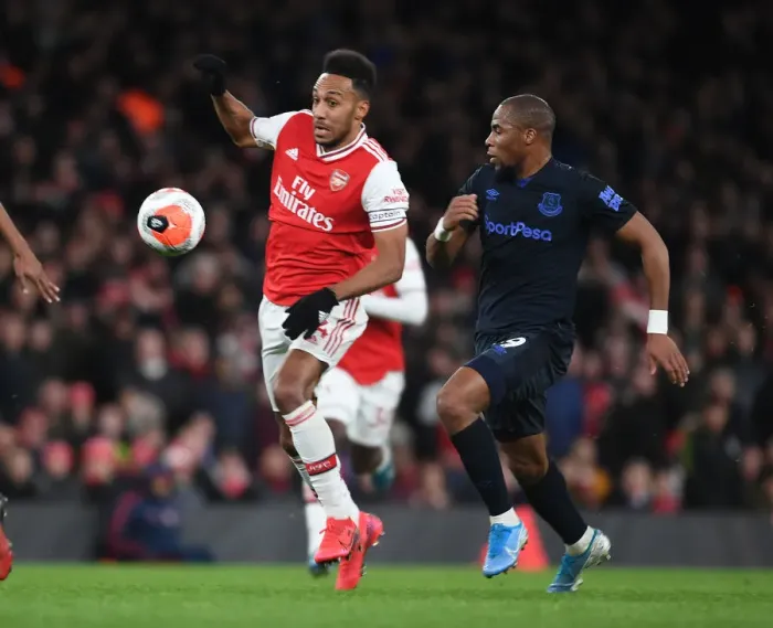 Framed Print : Arsenal's Aubameyang Scores Past Everton's Sidibe in Premier League Showdown