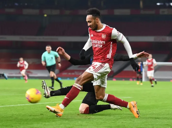 Framed Print : Arsenal's Aubameyang Shines Alone: A Beacon in Empty Emirates During Arsenal vs. Crystal Palace Match