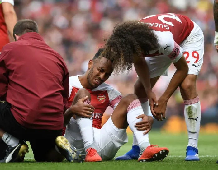 Framed Print : Arsenal's Aubameyang Suffers Injury in Arsenal v West Ham United Premier League Clash Framed Print : Arsenal's Aubameyang Suffers Injury in Arsenal v West Ham United Premier League Clash