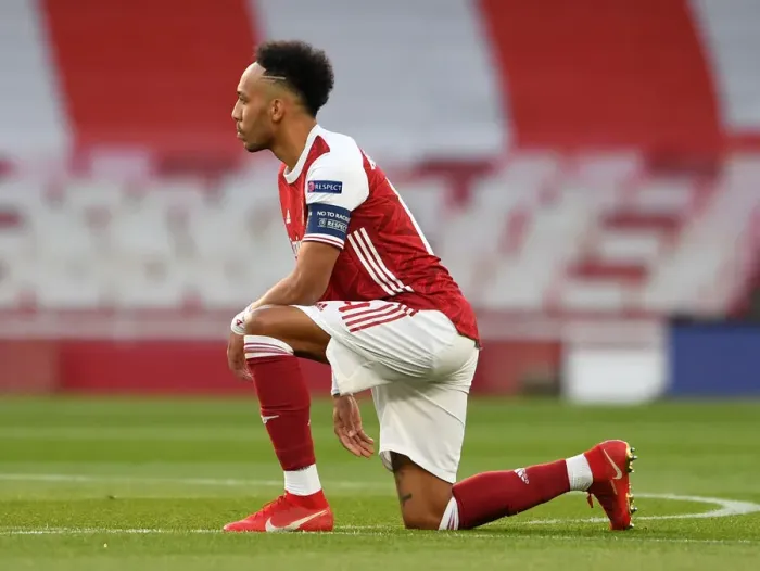 Framed Print : Arsenal's Aubameyang Takes a Knee in Empty Emirates Stadium during Europa League Semi-Final vs Villarreal Framed Print : Arsenal's Aubameyang Takes a Knee in Empty Emirates Stadium during Europa League Semi-Final vs Villarreal