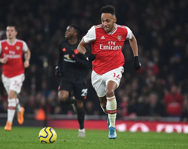Arsenal's Aubameyang Takes on Manchester United in Premier League Clash