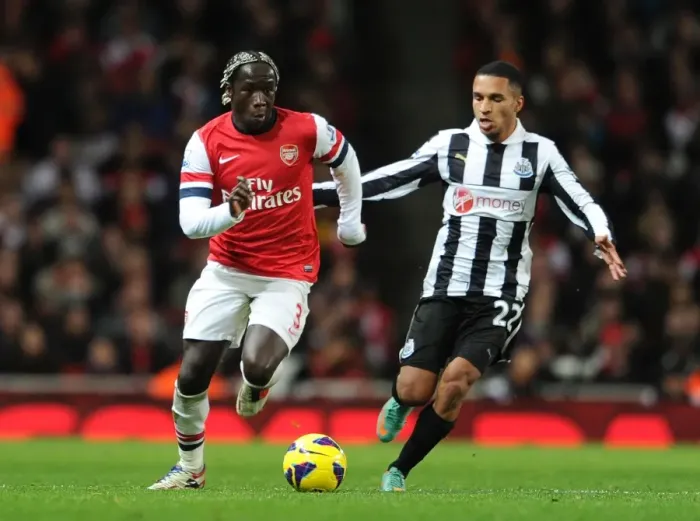 Framed Print : Arsenal's Bacary Sagna Clashes with Newcastle's James Tavernier in Premier League Showdown Framed Print : Arsenal's Bacary Sagna Clashes with Newcastle's James Tavernier in Premier League Showdown