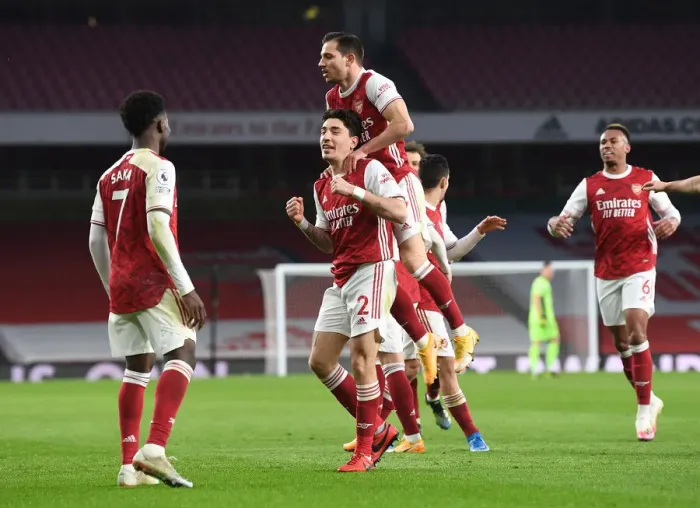 Framed Print : Arsenal's Bellerin, Saka, and Cedric Celebrate Goals Against Leeds United in 2021 Premier League Match Framed Print : Arsenal's Bellerin, Saka, and Cedric Celebrate Goals Against Leeds United in 2021 Premier League Match