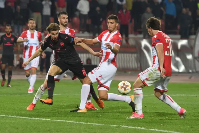 Framed Print : Arsenal's Ben Sheaf Clashes with Filip Stojkovic and Srdan Babic of Red Star Belgrade in Europa League Match Framed Print : Arsenal's Ben Sheaf Clashes with Filip Stojkovic and Srdan Babic of Red Star Belgrade in Europa League Match