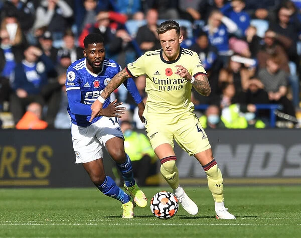 Arsenal's Ben White Faces Off Against Leicester's Kelechi Iheanacho in Premier League Clash