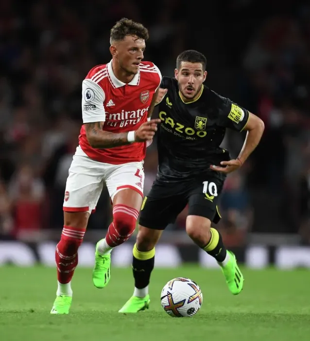 Framed Print : Arsenal's Ben White Outmuscles Aston Villa's Emiliano Buendia during the 2022-23 Premier League Clash at Emirates Stadium Framed Print : Arsenal's Ben White Outmuscles Aston Villa's Emiliano Buendia during the 2022-23 Premier League Clash at Emirates Stadium