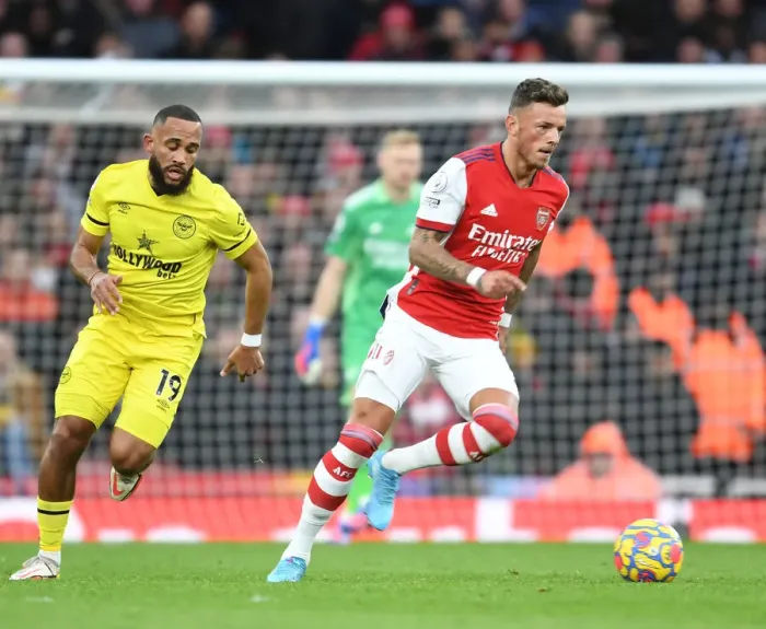 Framed Print : Arsenal's Ben White Outsmarts Brentford's Mbeumo: A Premier League Showdown at Emirates Stadium Framed Print : Arsenal's Ben White Outsmarts Brentford's Mbeumo: A Premier League Showdown at Emirates Stadium