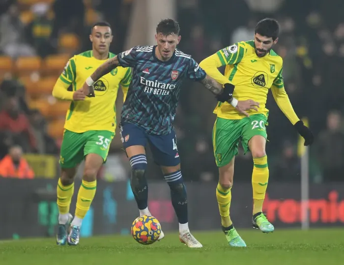 Framed Print : Arsenal's Ben White vs. Norwich's Pierre-Lees Melou: A Premier League Battle at Carrow Road (Norwich City vs. Arsenal 2021-22)