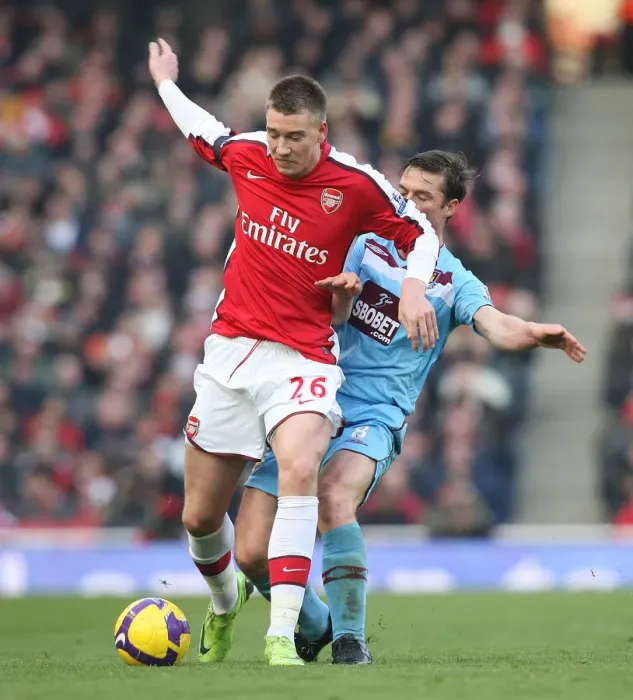 Framed Print : Arsenal's Bendtner and Parker Face Off in Scoreless Draw Against West Ham, Emirates Stadium, 2009 Framed Print : Arsenal's Bendtner and Parker Face Off in Scoreless Draw Against West Ham, Emirates Stadium, 2009