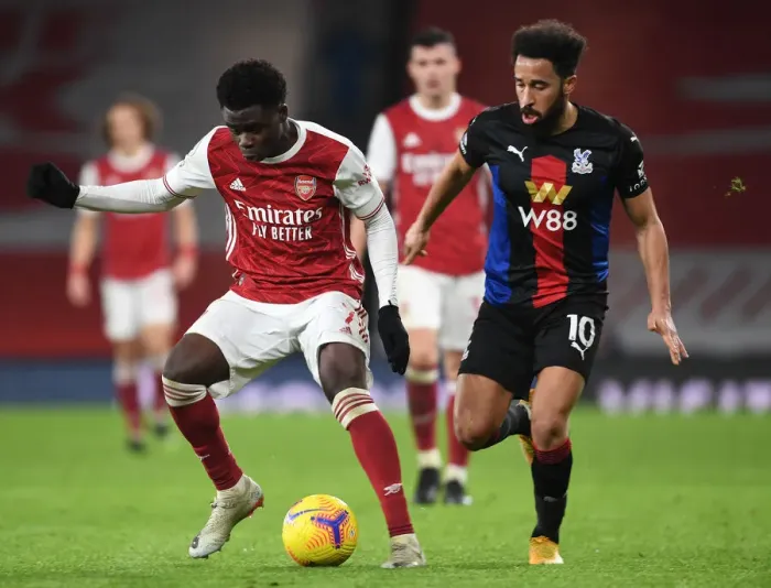 Framed Print : Arsenal's Bukayo Saka in Action: Premier League Clash Against Crystal Palace at Empty Emirates Stadium (2020-21) Framed Print : Arsenal's Bukayo Saka in Action: Premier League Clash Against Crystal Palace at Empty Emirates Stadium (2020-21)