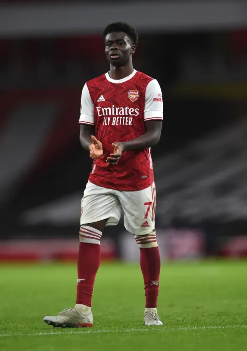 Framed Print : Arsenal's Bukayo Saka Celebrates with Fans after Arsenal v Burnley Victory (2020-21) Framed Print : Arsenal's Bukayo Saka Celebrates with Fans after Arsenal v Burnley Victory (2020-21)