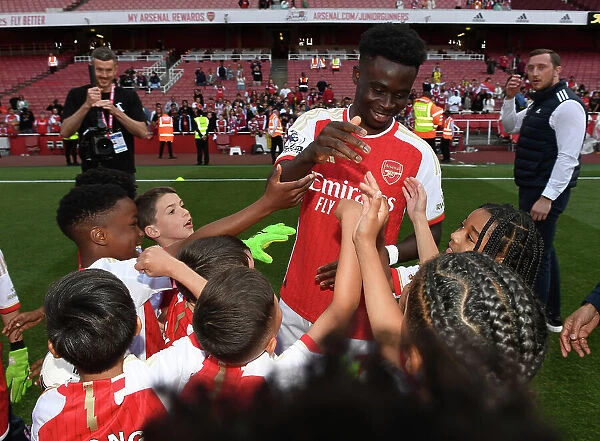Arsenal's Bukayo Saka Celebrates Victory and Greets Academy Players