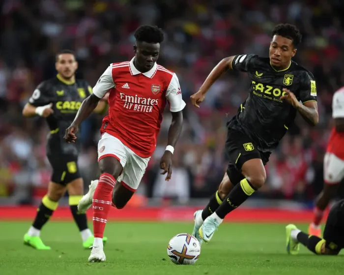 Framed Print : Arsenal's Bukayo Saka Clashes with Aston Villa's Jacob Ramsey in 2022-23 Premier League Showdown Framed Print : Arsenal's Bukayo Saka Clashes with Aston Villa's Jacob Ramsey in 2022-23 Premier League Showdown
