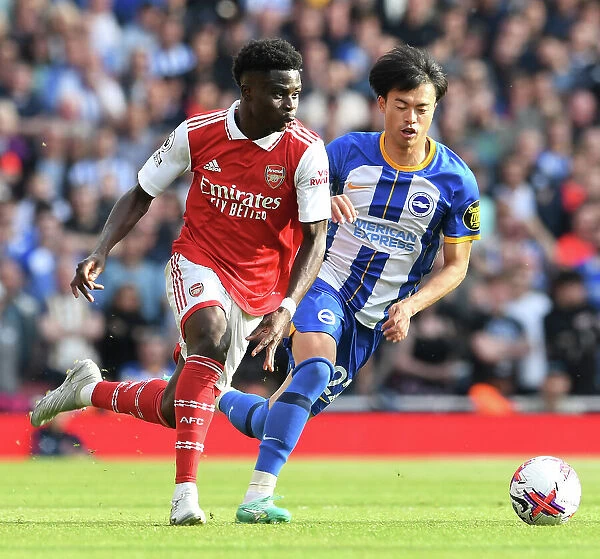 Arsenal's Bukayo Saka Clashes with Brighton's Kaoru Mitoma in 2022-23 Premier League Showdown