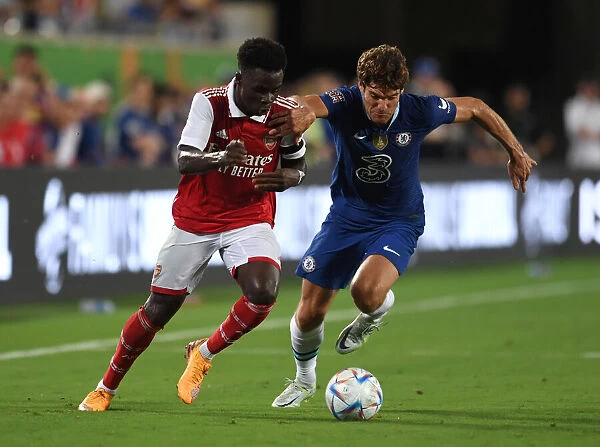 Arsenal's Bukayo Saka Clashes with Chelsea's Marcos Alonso in the Florida Cup 2022-23
