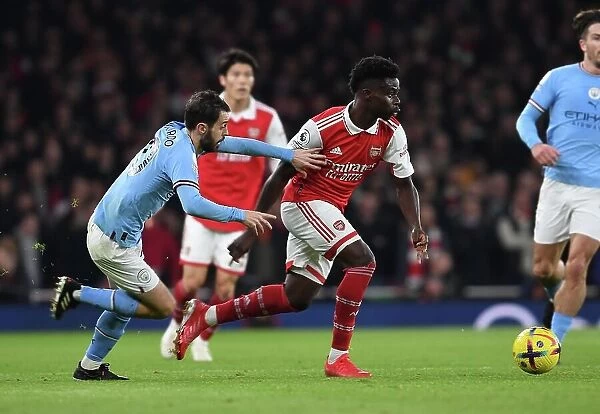 Arsenal's Bukayo Saka Clashes with Manchester City's Ilkay Gundogan in Premier League Showdown