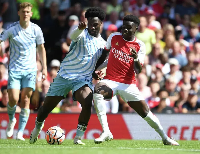 Framed Print : Arsenal's Bukayo Saka Clashes with Nottingham Forest's Ola Aina in 2023-24 Premier League Showdown Framed Print : Arsenal's Bukayo Saka Clashes with Nottingham Forest's Ola Aina in 2023-24 Premier League Showdown