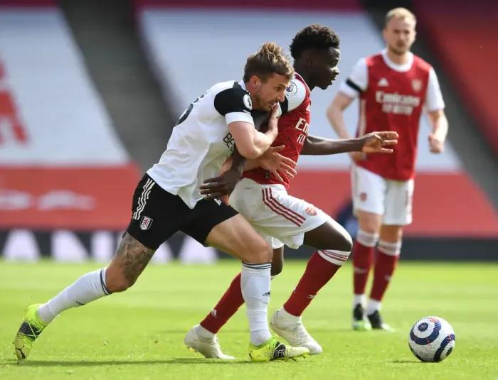 Framed Print : Arsenal's Bukayo Saka Faces Off Against Fulham's Joe Bryan in Empty Emirates Stadium, Premier League 2020-21 Framed Print : Arsenal's Bukayo Saka Faces Off Against Fulham's Joe Bryan in Empty Emirates Stadium, Premier League 2020-21