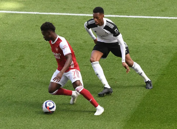 Framed Print : Arsenal's Bukayo Saka Faces Off Against Fulham's Tosin Adarabioyo in Empty Emirates Stadium, Premier League 2020-21