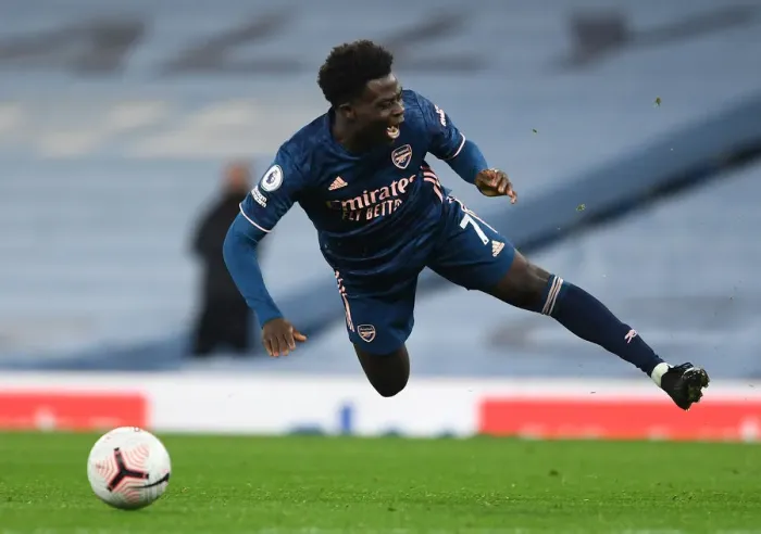 Framed Print : Arsenal's Bukayo Saka Faces Off Against Manchester City in Premier League Clash