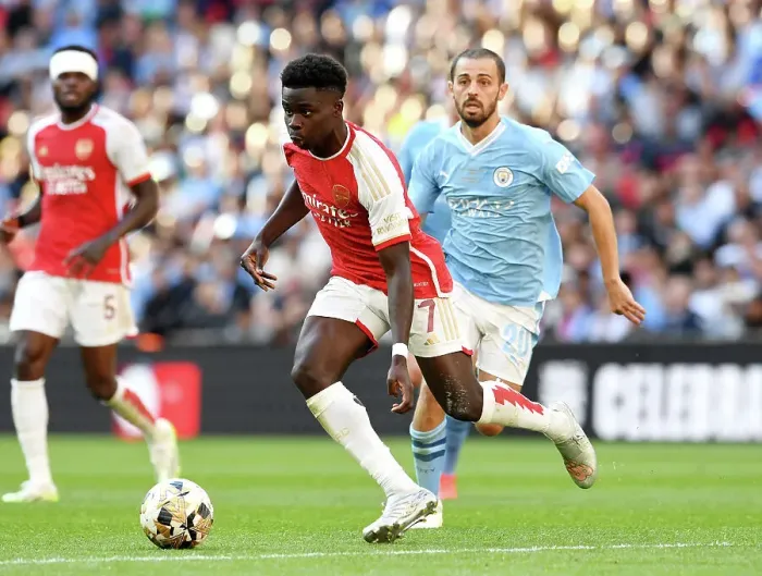 Framed Print : Arsenal's Bukayo Saka Faces Off Against Manchester City's Bernardo Silva in FA Community Shield Showdown Framed Print : Arsenal's Bukayo Saka Faces Off Against Manchester City's Bernardo Silva in FA Community Shield Showdown