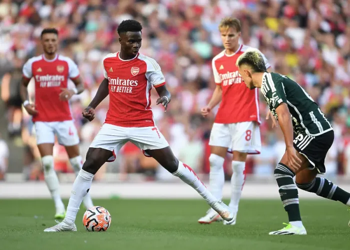 Framed Print : Arsenal's Bukayo Saka Faces Off Against Manchester United in the Premier League (2023-24) Framed Print : Arsenal's Bukayo Saka Faces Off Against Manchester United in the Premier League (2023-24)
