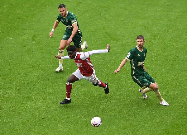 Arsenal's Bukayo Saka Faces Off Against Sheffield United Defenders