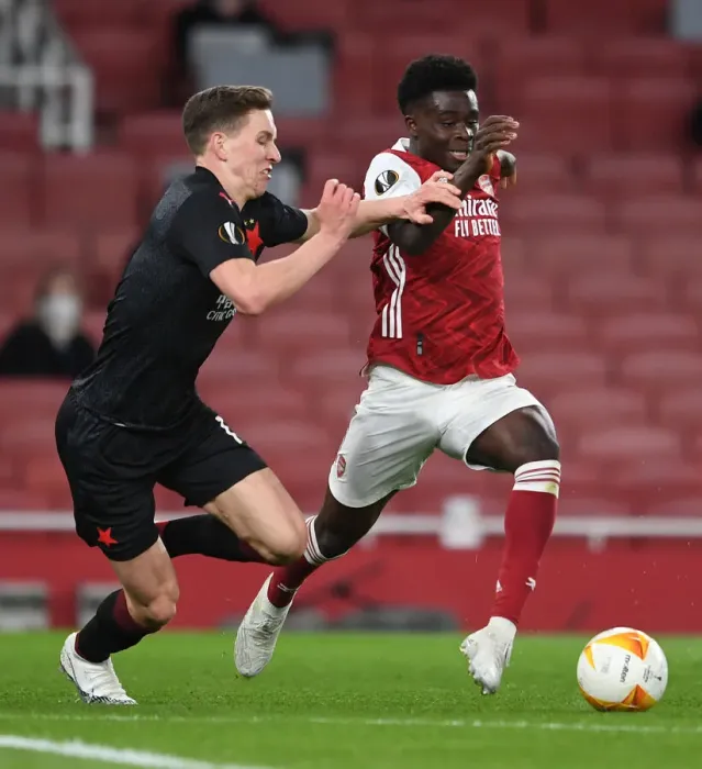 Framed Print : Arsenal's Bukayo Saka Faces Off Against Slavia Praha's Lukas Provod in UEFA Europa League Quarterfinal at Empty Emirates Stadium Framed Print : Arsenal's Bukayo Saka Faces Off Against Slavia Praha's Lukas Provod in UEFA Europa League Quarterfinal at Empty Emirates Stadium