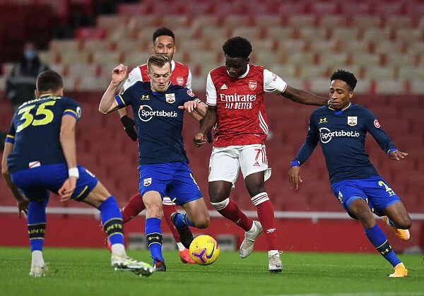 Arsenal's Bukayo Saka Faces Off Against Southampton's Ward-Prowse and Walker-Peters in Intense Premier League Showdown