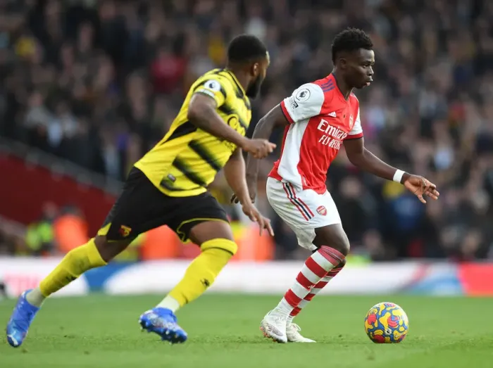 Framed Print : Arsenal's Bukayo Saka Faces Off Against Watford's Danny Rose in Premier League Clash Framed Print : Arsenal's Bukayo Saka Faces Off Against Watford's Danny Rose in Premier League Clash