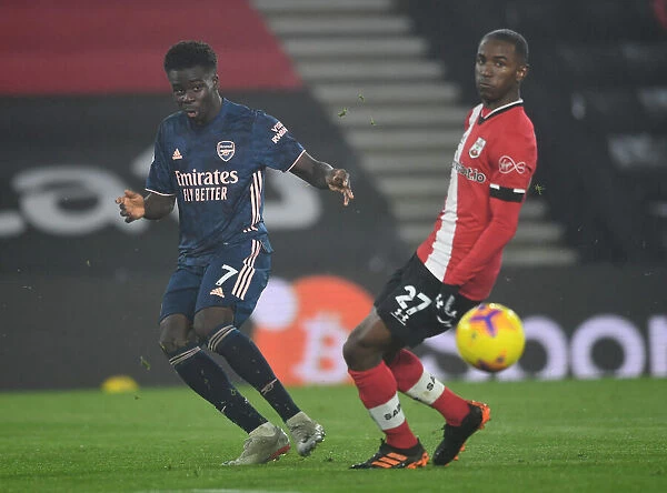 Arsenal's Bukayo Saka Faces Southampton's Ibrahima Diallo in Empty St. Mary's Stadium - Premier League Clash, January 2021