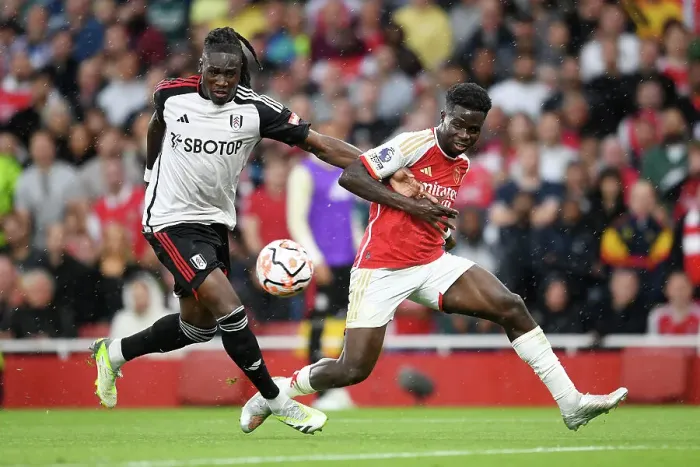 Framed Print : Arsenal's Bukayo Saka Fights for Possession Against Fulham in 2023-24 Premier League Clash