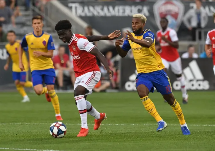 Framed Print : Arsenal's Bukayo Saka Goes Head-to-Head with Colorado Rapids Kellyn Acosta in Pre-Season Clash Framed Print : Arsenal's Bukayo Saka Goes Head-to-Head with Colorado Rapids Kellyn Acosta in Pre-Season Clash
