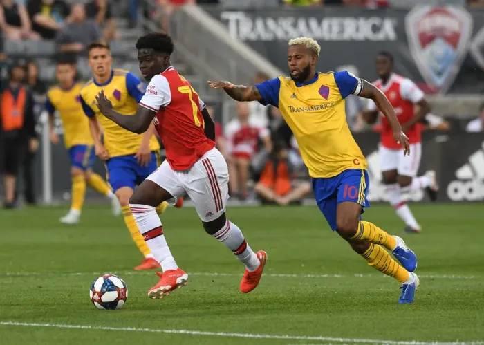 Framed Print : Arsenal's Bukayo Saka Goes Head-to-Head with Kellyn Acosta of Colorado Rapids in Pre-Season Clash Framed Print : Arsenal's Bukayo Saka Goes Head-to-Head with Kellyn Acosta of Colorado Rapids in Pre-Season Clash