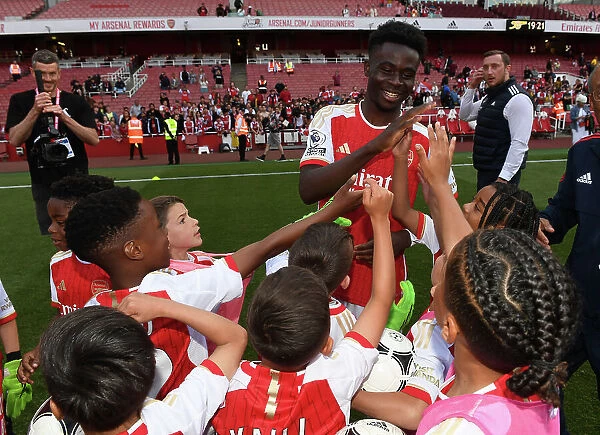 Arsenal's Bukayo Saka Greets Academy Players after Arsenal vs. Wolverhampton Wanderers (2022-23)